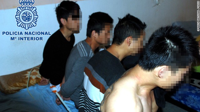 Spanish national police released this photo of four suspects arrested in the human trafficking bust.