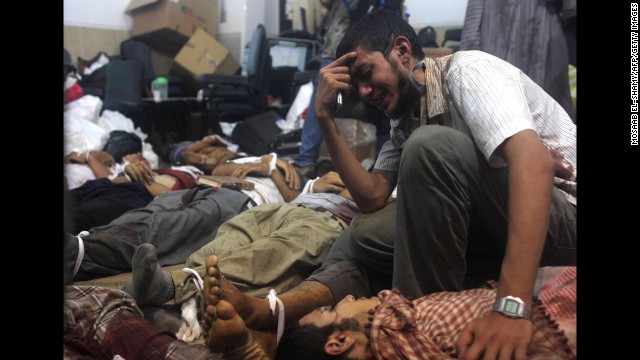 A man grieves at a makeshift morgue in Cairo on August 14.