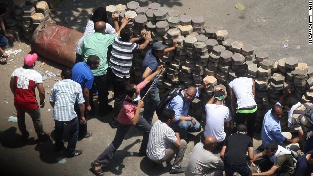 Morsy supporters confront police at Cairo's Mustafa Mahmoud Square on August 14.