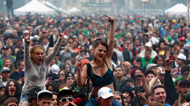 Members of a crowd numbering tens of thousands smoke and listen to live music at the Denver 420 Rally on April 20, 2013. <a href='http://www.cnn.com/2013/04/20/opinion/reiman-marijuana-day/index.html'>Annual festivals celebrating marijuana</a> are held around the world on April 20, a counterculture holiday.” border=”0″ height=”360″ id=”articleGalleryPhoto002″ style=”margin:0 auto;display:none” width=”640″/><cite style=