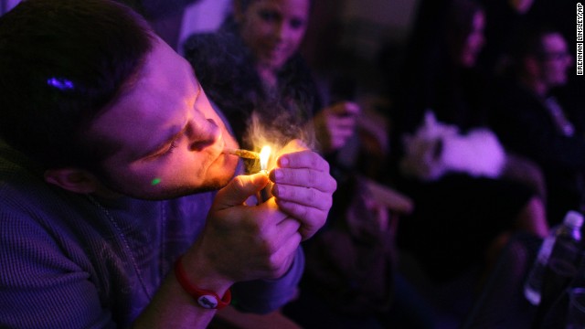 A man smokes a joint during the official opening night of Club 64, a marijuana social club in Denver, on New Year's Eve 2012. Voters in <a href='http://www.cnn.com/2012/11/07/politics/marijuana-legalization/index.html'>Colorado and Washington state</a> passed referendums to legalize recreational marijuana on November 6, 2012.” border=”0″ height=”360″ id=”articleGalleryPhoto003″ style=”margin:0 auto;display:none” width=”640″/><cite style=