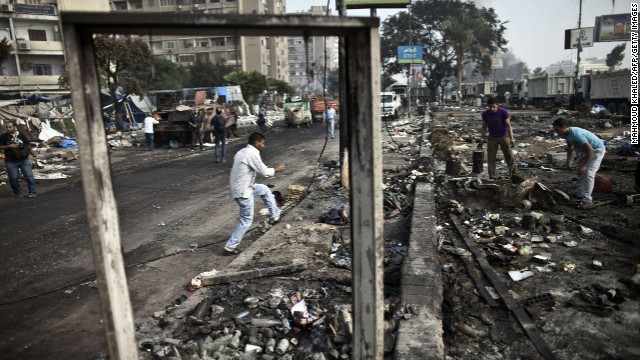 People search through debris at Rabaa al-Adawiya Square on August 15.