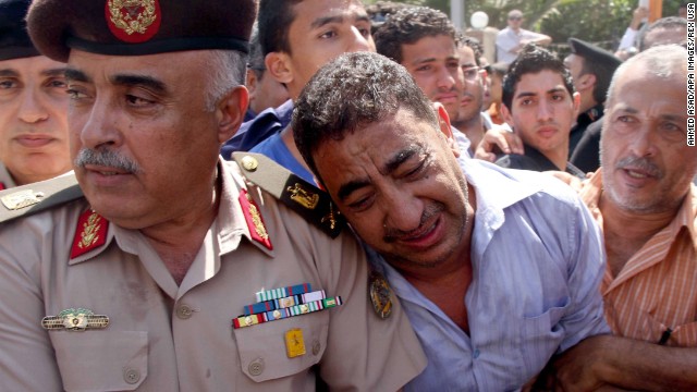 Egyptian police officers attend the funeral for their colleagues on August 15.