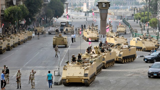 Egyptian soldiers take positions alongside armored vehicles as they guard the entrance to Tahrir Square in Cairo on Friday, August 16. 