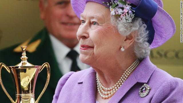 Queen Elizabeth II is all smiles after receiving the Gold Cup following her horse Estimate's triumph at Royal Ascot.