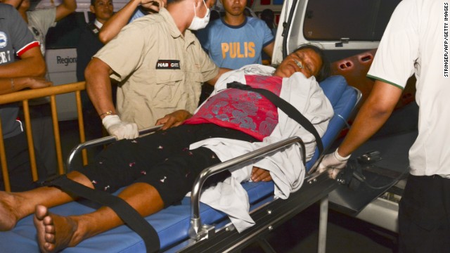 A survivor on a stretcher is taken to a hospital in Cebu City on August 17.