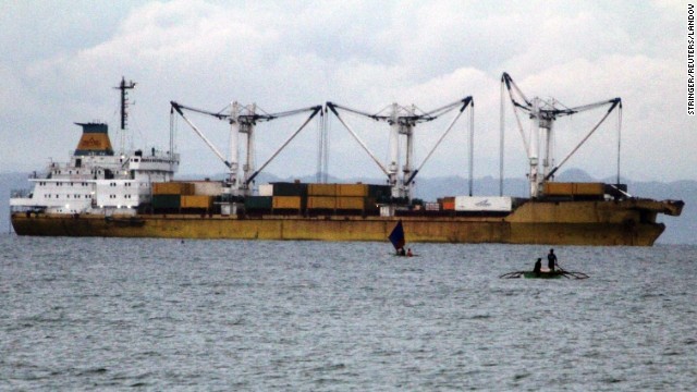 A cargo vessel is docked at sea after colliding with and sinking a ferry on Friday, August 16.