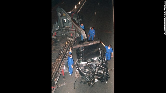 The wreckage of the car is prepared to be moved after the crash. 