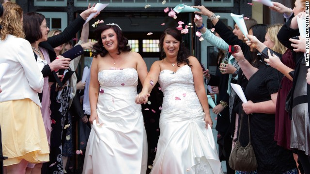 Rachel Briscoe, left, and Jess Ivess from the Bay of Islands celebrate during the first same-sex marriage at the Rotorua Museum in Rotorua, New Zealand, on Monday, August 19 -- the first day such marriages were legal in New Zealand.