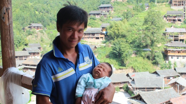 Like many young men in the village, Shi Tao is a migrant worker. He has returned home from the southern factory town of Dongguan for the birth of his first child but will soon leave again.