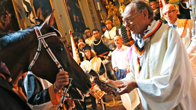 Before the Pailo di Siena riders make their 90-second dash around the city, each horse is blessed by a priest for the race which dates back to the 17th Century.