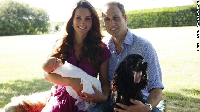 Catherine, Duchess of Cambridge, and Prince William, Duke of Cambridge, are pictured with their newborn boy, Prince George of Cambridge, and Tilly, left, a Middleton family pet, and Lupo, the couple's cocker spaniel. The new parents released two family photographs with their son, taken by Michael Middleton, Catherine's father.