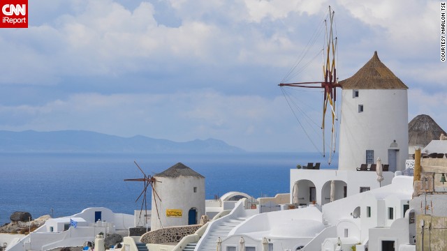 Windmills and white buildings fill the town of Oia on the Greek island of <a href='http://ireport.cnn.com/docs/DOC-973720'>Thira</a>, also known as Santorini. "I don't think it was possible for me to take a bad picture," said Marlon Tse.