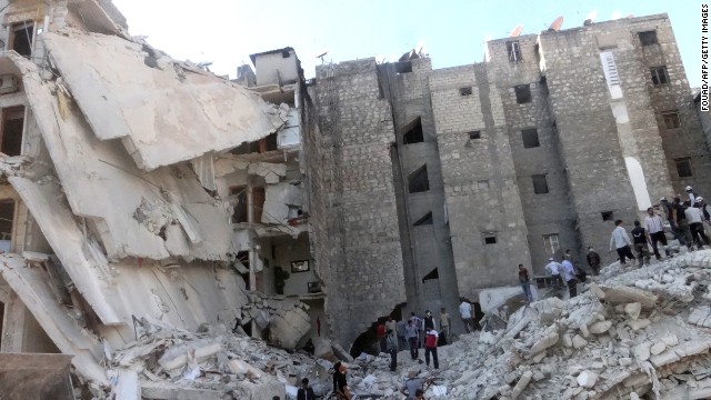 People search the rubble of a bombed building in Aleppo, Syria, on Friday, August 16.