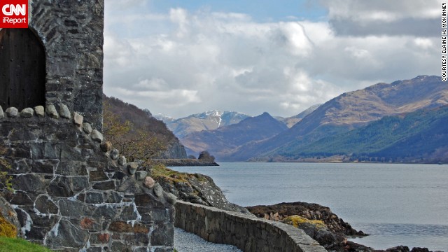 The Highlands of Scotland, seen here from <a href='http://ireport.cnn.com/docs/DOC-985075'>Eilean Donan Castle</a>, are "beautiful with a touch of snow on the mountains," says Elaine McKinney.