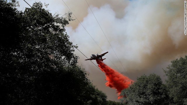 An air tanker drops fire retardant on a ridge ahead of the advancing Rim Fire on August 22, in Groveland, California. The Rim Fire continues to burn out of control and has entered Yosemite National Park.