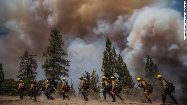 Los Angeles County firefighters hike in on a fire line on the Rim Fire near Groveland, California, on August 22. 