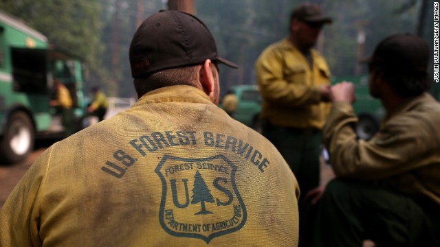U.S. Forest Service firefighters take a break from battling the Rim Fire at Camp Mather on August 25.