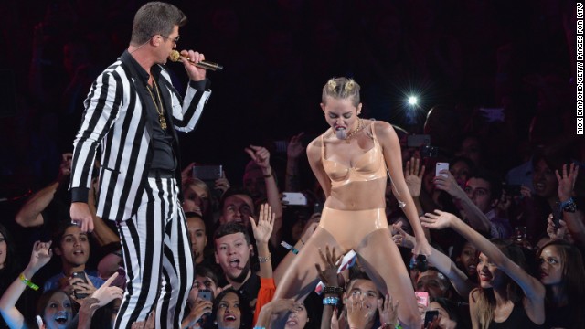 Cyrus shows off her moves with Robin Thicke during the 2013 MTV Video Music Awards in Brooklyn, New York, on Sunday, August 25.
