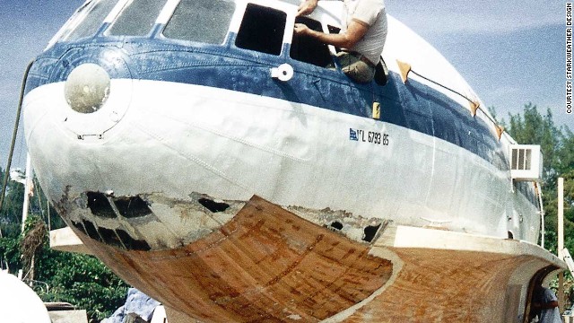 Owner Dave Drimmer, rebuilding the hull of his "planeboat" in 1994.