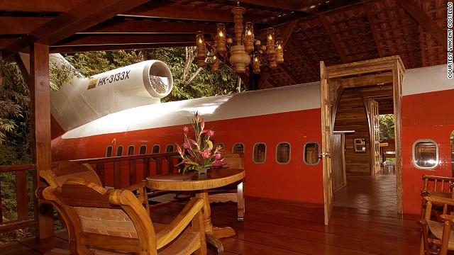 The emergency door on the 727 leads to a relaxing lunch area on the patio, built above the right wing of the airplane. Unexpected guests may include sloths and monkeys. 