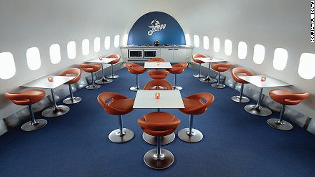 With commercial seats removed, airplanes look surprisingly larger inside. This is the dining area at Jumbo Stay.