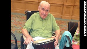 Dr. Sanford A. Shmerling, who has Alzheimer\'s, joined in drum circle activity recently at his nursing home in Atlanta. 