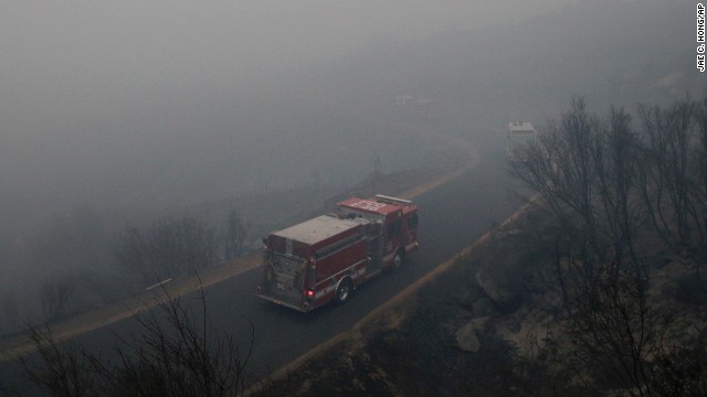 Firetrucks drive through heavy smoke generated by the Rim Fire near Yosemite on August 27.