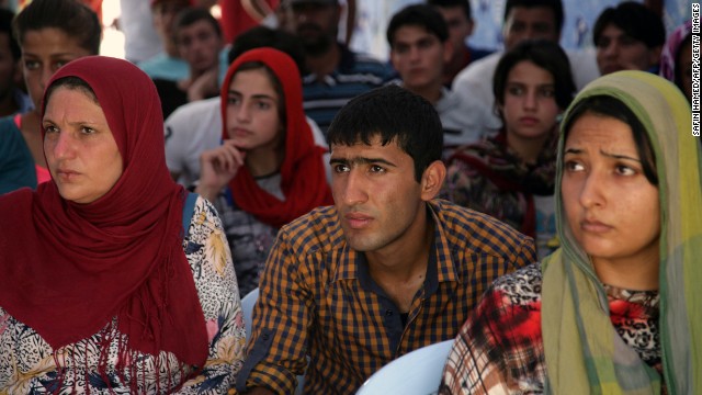 Syrian refugees listen to safety instructions at the Quru Gusik refugee camp on Saturday, August 24.