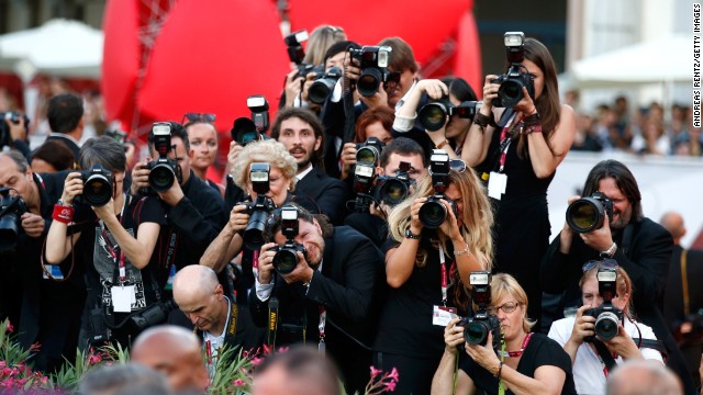 Photographers at the opening ceremony on August 28.