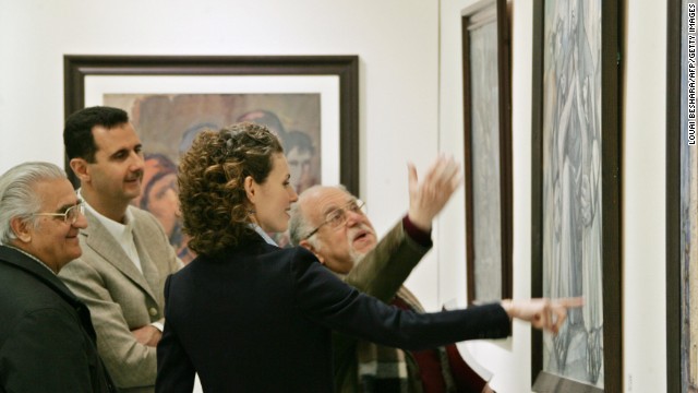 Bashar and Asma al-Assad listen to Syrian artist Elias al-Zayat during a visit to an exhibition at the national museum in Damascus on February 23, 2008.