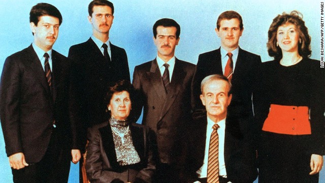 An undated photo shows current Syrian President Bashar al-Assad, second from left, posing with his family. Al-Assad's parents, then-President Hafez Assad and his wife, Anisa, in front, and his siblings in the second row; Maher, Bassel, Majd and Bushra.