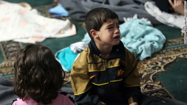 A young survivor takes shelter in a mosque in the Duma neighborhood of Damascus on August 21. 