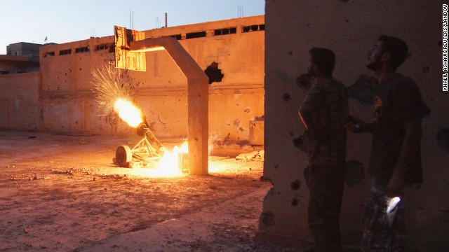 Free Syrian Army fighters launch a rocket toward forces loyal to Syrian President Bashar al-Assad in Deir Ezzor on August 29.