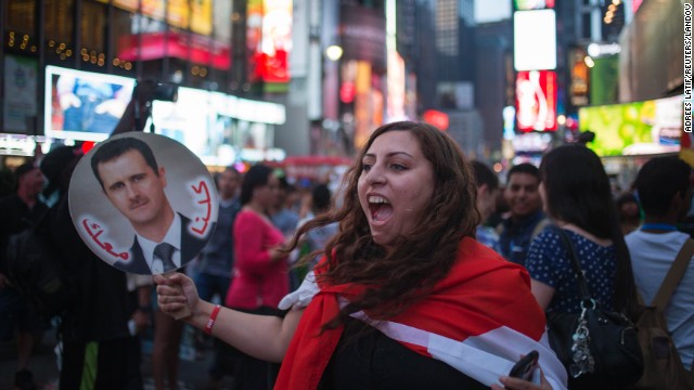 A Syrian-American supporter of Syrian President Bashar al-Assad participates in an anti-war rally in New York's Times Square on August 29.