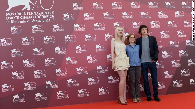 Actress Dakota Fanning, left, with director Kelly Reichardt and actor Jesse Eisenberg, pose during the photo call of "Night Moves," which was presented in the competition at the festival on August 31.