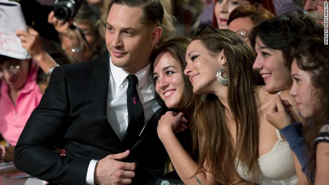 Actor Tom Hardy poses with fans on the red carpet for the film "Locke" at the Venice Film Festival on September 2.