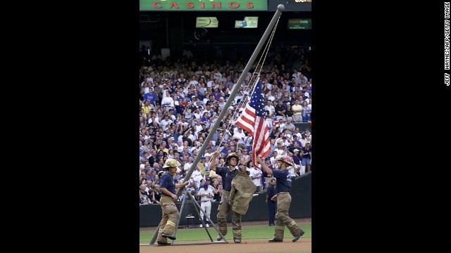 Firemen re-create the flag raising during the 2001 World Series in Phoenix, Arizona, on October 27, 2001.