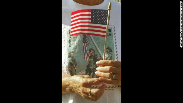 The image can also be found on T-shirts, like this one worn by Venita Bradford at a memorial service in Energy, Illinois, on September 11, 2002.