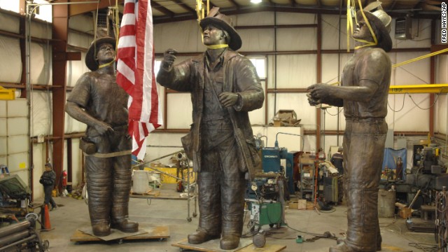 A 40-foot-tall bronze monument named "To Lift a Nation" depicts the famous scene. Pictured at a warehouse in 2007, the sculpture is now part of the permanent collection at the National Fallen Firefighters Memorial Park in Emmitsburg, Maryland.