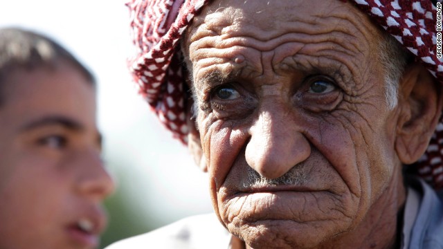 Syrian refugees gather in the village of Salkin after crossing the Syrian-Turkish border on September 5.