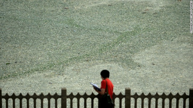 A man surveys the scene on the river.