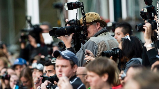 Photographers and fans vie for celebrities' attention on the red carpet at the gala for "The Fifth Estate."