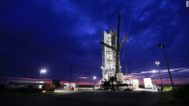 Engineers prepare to put the rocket into place.