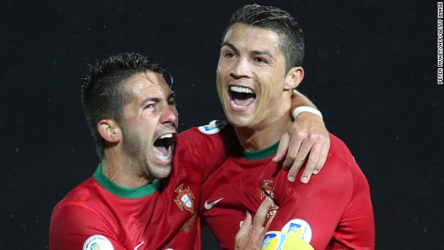 Portugal's Cristiano Ronaldo (right) celebrates scoring his second goal against Northern Ireland at Windsor Park in Belfast.