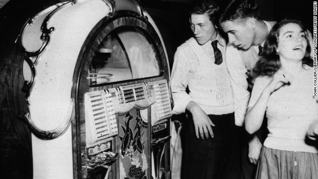 Teenagers stand by a jukebox in a dance hall in Richwood, West Virginia in September, 1942.