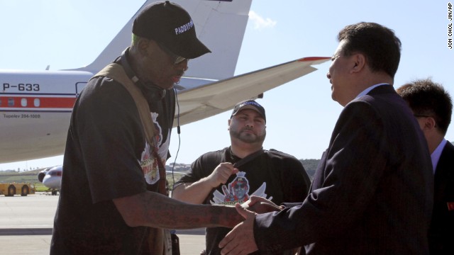 Son Kwang Ho, vice chairman of North Korea's Olympic Committee, greets Rodman at the Pyongyang airport on September 3. 