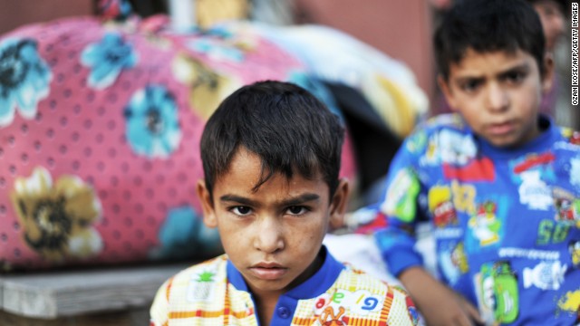 Syrian refugees arrive at the Pir Sultan Abdal foundation in Istanbul on September 8.