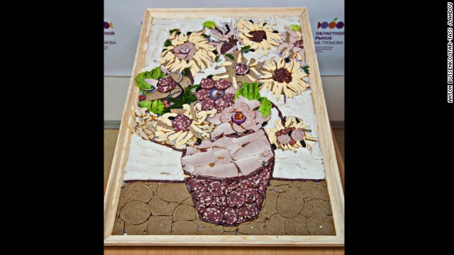 A reproduction of van Gogh's "Sunflowers" made with meats and sausages is exhibited at Yekaterinburg's food market in Russia in 2012.