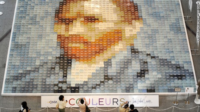 A huge reproduction of van Gogh's self-portrait made of 2,070 polo shirts in 24 different colors is displayed on the ground floor of the Marunouchi Building in Tokyo, Japan, in 2010, created by Japanese apparel company Onward Kashiyama.